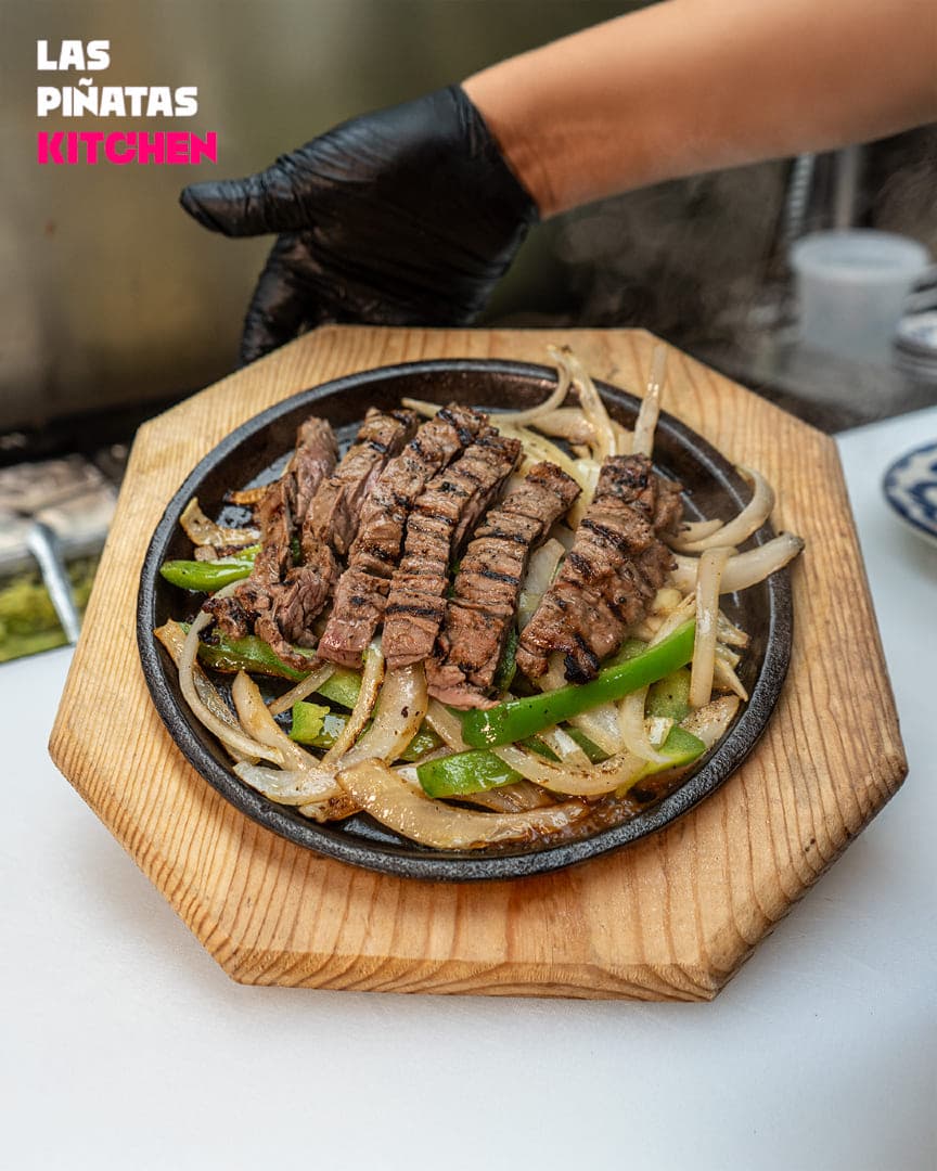 Beef Fajitas — signature Mexican dish at Las Piñatas Kitchen in Tomball, TX